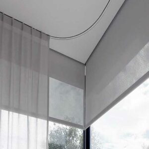 Corner flush curtain tracks